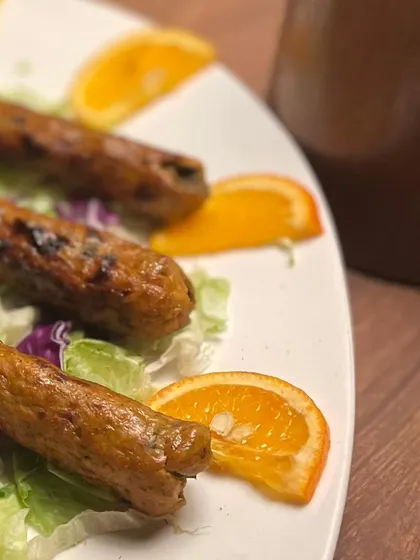 Another view of the seekh kebabs, ready for a catering event. The simple, fresh presentation allows the quality of the food to speak for itself.