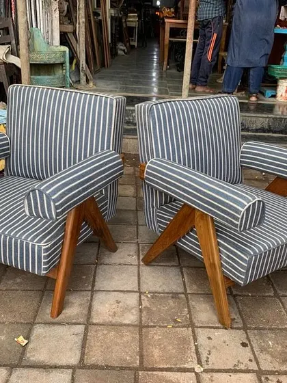 This pair of handcrafted chairs is ready to add a touch of mid-century flair to any interior.