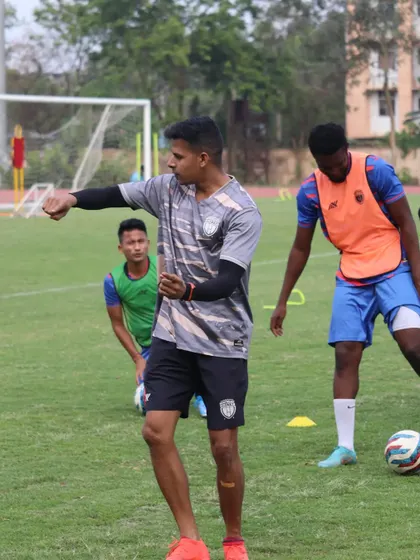 Demonstrating a movement pattern to the players. I believe in showing, not just telling, to ensure exercises are performed correctly.