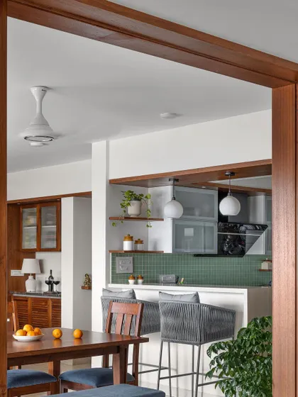 A view from the dining room into the 'Gulmohar' kitchen, showing how the different zones flow into one another.
