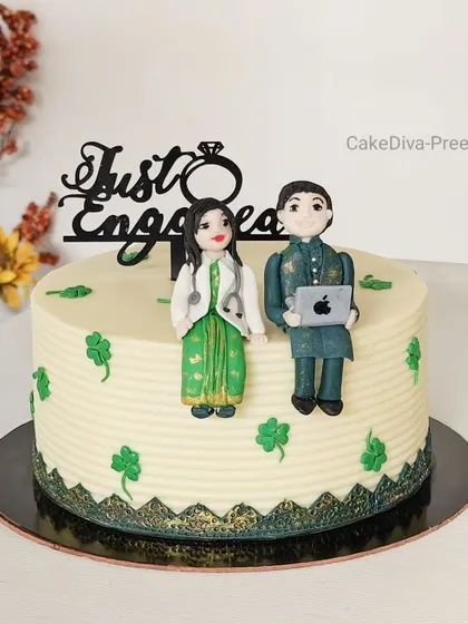 A different view of the engagement cake for the doctor and IT professional, showing the clean, ribbed buttercream finish and lucky clover details.