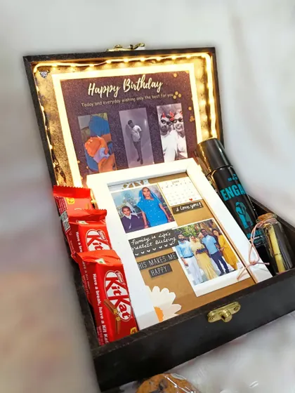 This hamper is filled with personal touches, including a custom photo frame collage and a light-up birthday message, alongside his favorite chocolates and a deodorant.