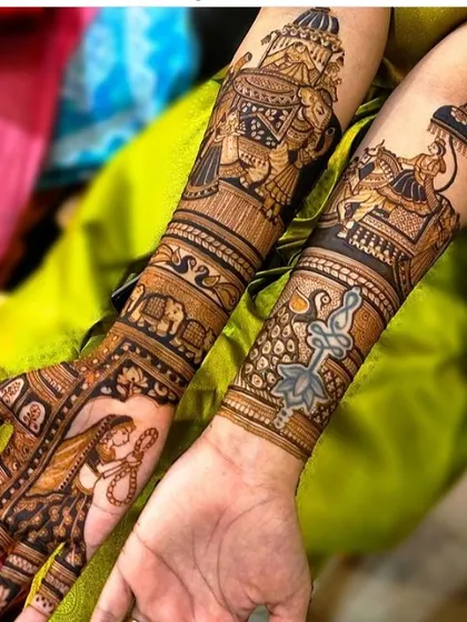 This unique design features a groom on a horse on one arm and a bride in a doli on the other. The palms show the bride with a sword and lotus, creating a powerful image.