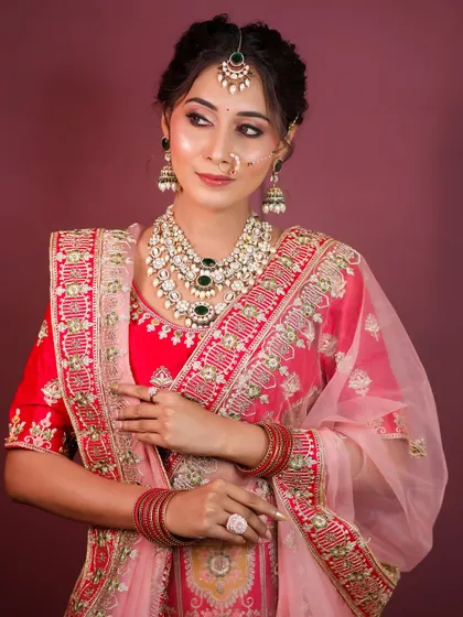 A full view of the bridal lehenga look, demonstrating my skill in makeup, hair, and dupatta draping.