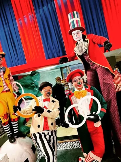 Our carnival entertainers posing for a photo. The vibrant costumes and props were an integral part of creating an immersive and exciting atmosphere for all the guests.