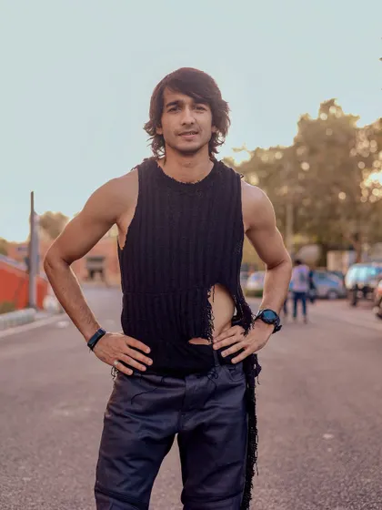 A full-body portrait showcasing the actor's physique and edgy styling, perfect for casting calls requiring a specific look.