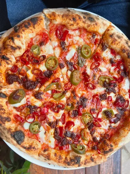 A top-down shot of our spicy jalapeño pizza. Look at those vibrant colours.