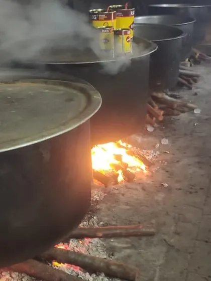 The 'dum' process underway for a 150kg mutton biryani order in Tirunelveli. We use premium ghee, as seen by the tins on the vessel, to add richness and flavour.