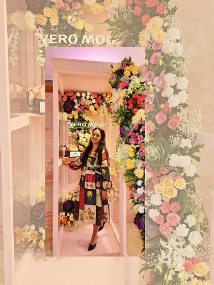 A whimsical moment at the Vero Moda event, making a wish for the year ahead. These events are not just work, but moments of joy and magic.
