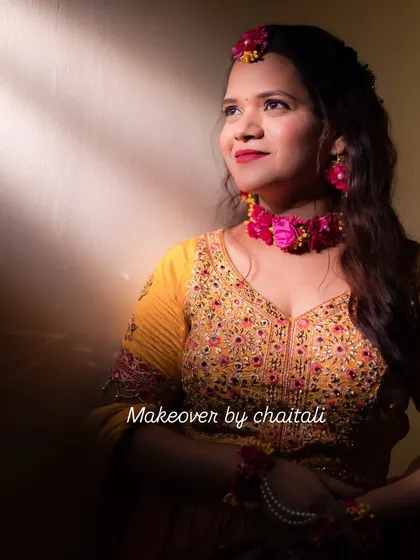 A close-up of the Haldi makeup, showing the soft pink and gold tones on the eyes and a fresh, dewy finish on the skin.