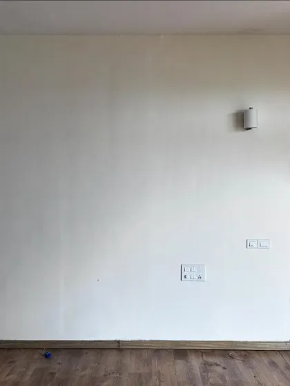 Before: The master bedroom in 'Cover me in Sunshine' was a blank canvas with a plain wall and a standard door to the bathroom.