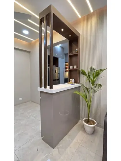 A wide view of the partition, showing its placement relative to the living area and kitchen entrance.