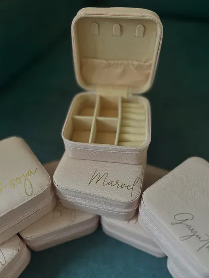 Another look at the personalized jewelry boxes, showing the neat compartments inside for rings and other small items.