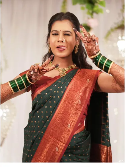 A playful wink and a peace sign, this candid photo perfectly captures the bride's fun-loving spirit.