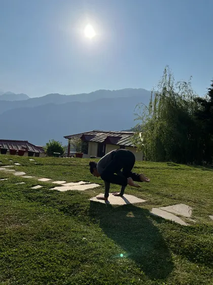 Taking flight in Bakasana, or crow pose, on a stone path in the Himalayas. Arm balances require focus and core strength, and the stillness of the morning provides the perfect environment to practice.