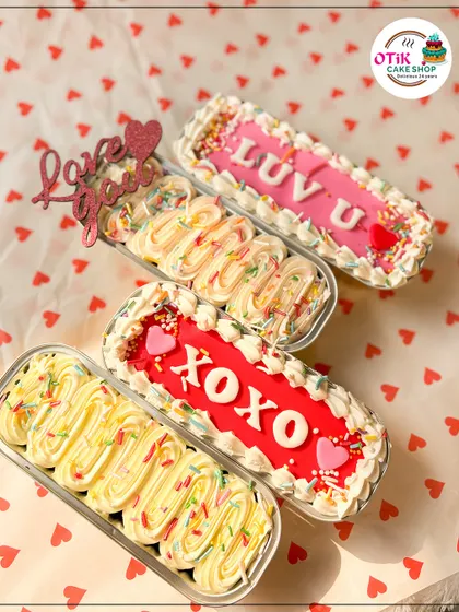 My special Valentine's Day loaf cakes, decorated with messages like "LUV U" and "XOXO." They are a sweet and personal way to share your feelings.