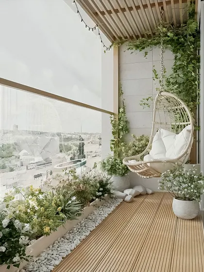 A serene, all-white theme featuring a beautiful wicker swing chair. The light colors, combined with climbing ivy and soft planters, create a bright and airy feel, perfect for a peaceful escape.