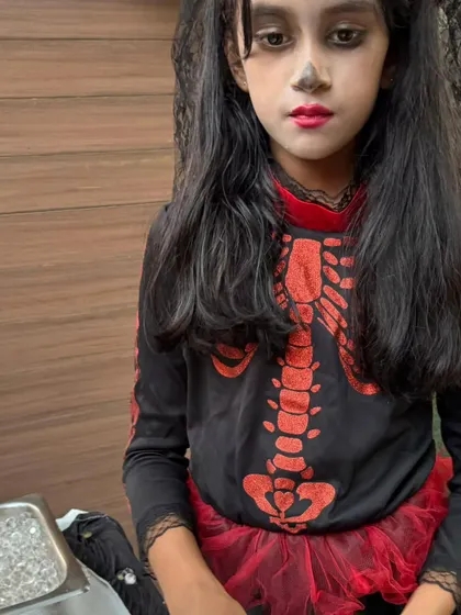 This girl's full skeleton costume, with a red tutu for a pop of color, is absolutely fantastic. The kids' efforts always amaze me.