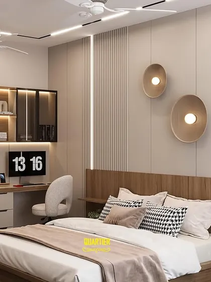 This modern teenager's bedroom is designed to be a stylish retreat. The design includes a large two-person workstation with overhead storage, perfect for homework and hobbies. The back wall features a mix of wood paneling and neutral tones.