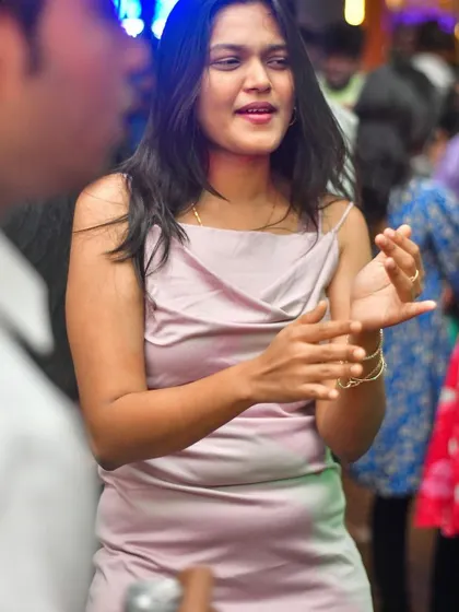A candid moment of a guest enjoying the conversation and music.