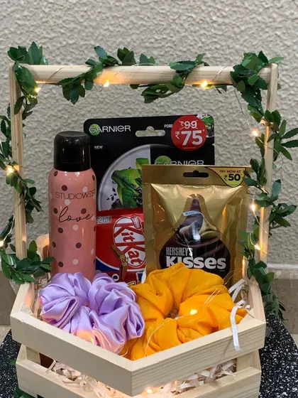 My rustic hexagon basket is a popular choice for a fun and thoughtful gift. This one is filled with self-care goodies like a Garnier face mask, a 'love' deodorant, colorful scrunchies, and of course, some delicious Hershey's Kisses and KitKat.