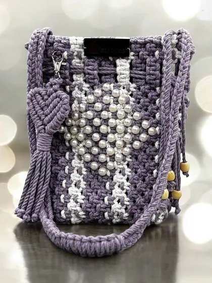 This lavender and white bag with a heart-shaped pearl design is pure romance. It also comes with a cute heart-shaped tassel.