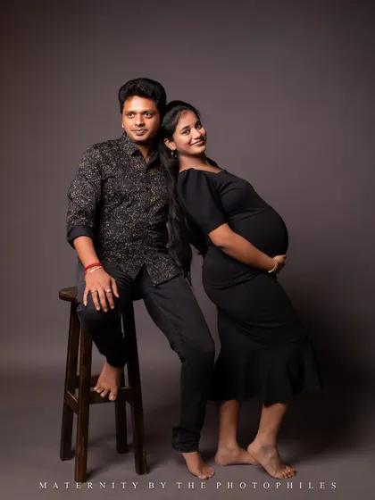A classic studio portrait of the couple. The simple background and clean lighting put all the focus on their happy expressions and connection.