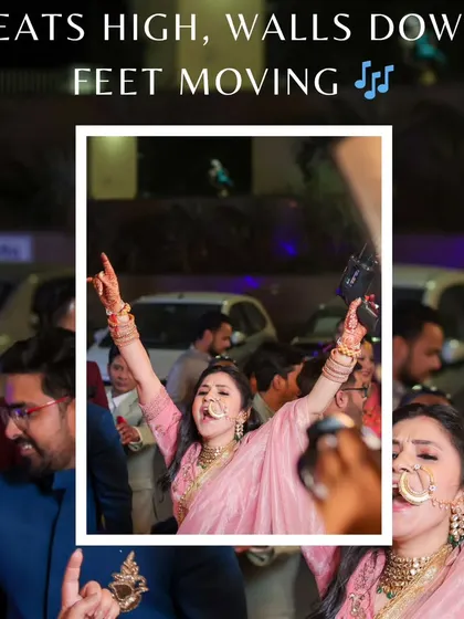 A candid shot of a wedding guest dancing with her hands in the air, capturing the pure energy of the baraat.