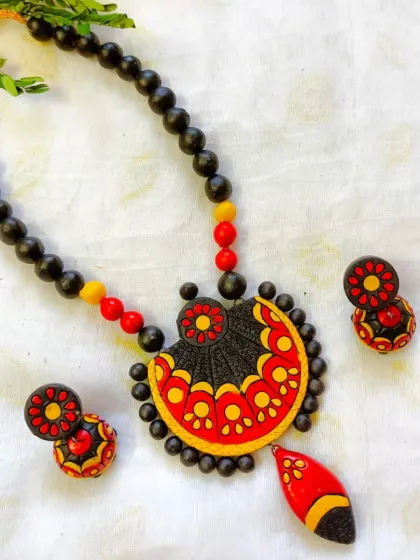 The same fan-design necklace in a classic red and yellow combination.