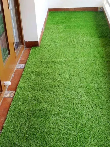A perfect example of a simple balcony upgrade. I installed this artificial grass mat to cover the old tiles, instantly creating a softer and greener space right outside the door.