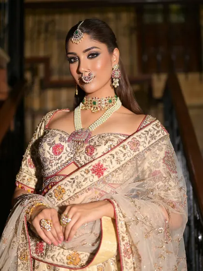 A powerful and confident pose. The dramatic eye makeup is the star of the show, perfectly balanced by a neutral lip and glowing skin.