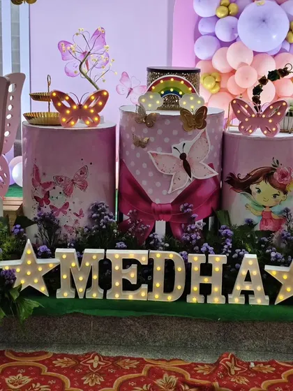 A close-up of the themed pedestals for the butterfly party.