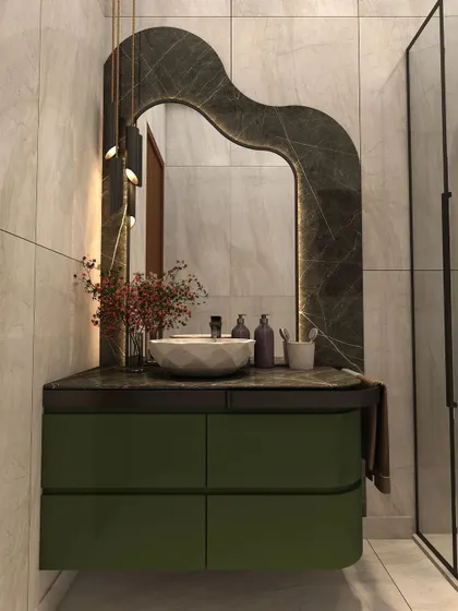 This modern bathroom, designed for a client's son, features a rich green vanity and an irregularly shaped backlit mirror as a captivating focal point.