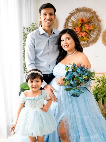 A growing family! This beautiful maternity portrait includes the excited big sister-to-be, capturing a special time for the whole family.