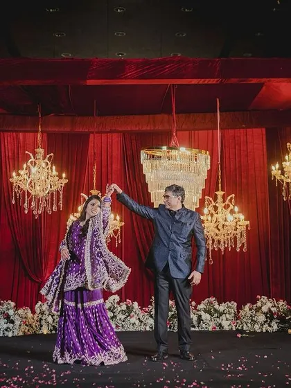 A beautiful performance by the bride's parents against a grand, royal backdrop. It's a memory they will cherish forever.