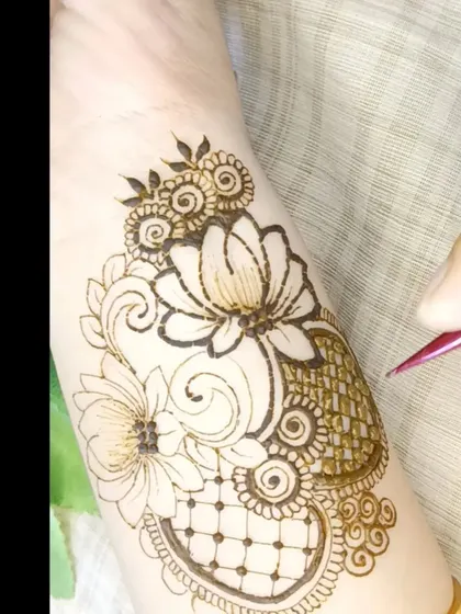 Watch as I add the final details to this lotus patch design. This shows how shading and fine lines can transform a simple outline.