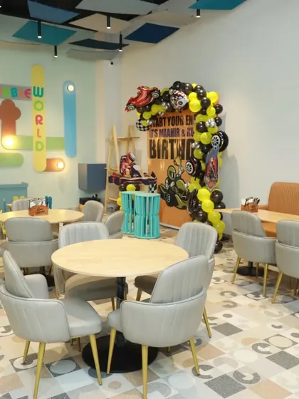 A cool black and yellow racing theme for a birthday party, showing how we can customize decor to any color scheme or interest.