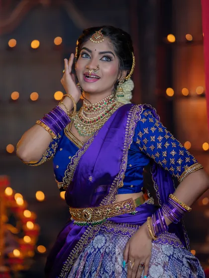 A joyful and expressive shot. The makeup is vibrant and celebratory, perfect for the festive spirit of Diwali.