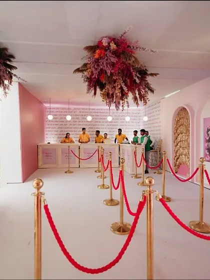 The registration area for the "Fireworks" event was designed to be an experience in itself, with floral clouds hanging from the ceiling and artfully arranged niches.