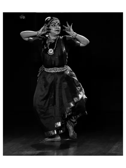 A black and white shot capturing the intensity and focus of Chaitra Rao during her performance.