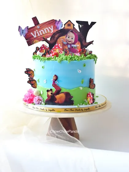 Another angle of the Masha and the Bear cake, showing the personalized "Vinny" sign.