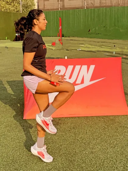 Practicing form drills before a group run. These exercises help activate the right muscles and reinforce proper running mechanics to prevent injuries.