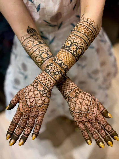 A crossed-arm pose that highlights the intricate patterns and the overall composition of the design.