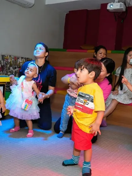 Kids enjoying the movie screening or a show in our theatre area.