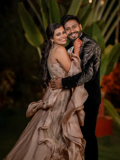 A stylish reception look. We love capturing the glamour and fun of the evening party, from the designer outfits to the happy, candid interactions.