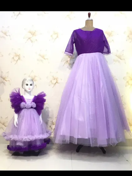 This is the full twinning set for the butterfly party, displayed on mannequins. You can see the different shades of purple and the layered tulle I used.