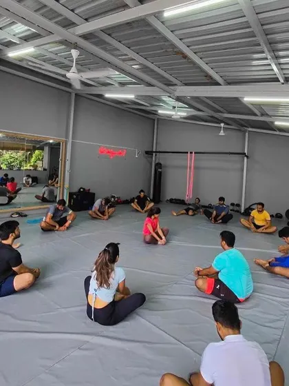 The whole class stretching it out after a tough glute focused workout.