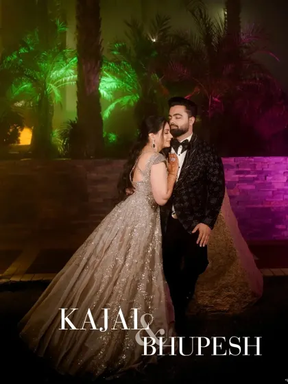 A glamorous outdoor portrait of the couple at night. The colorful lighting and their elegant pose make for a stunning engagement photo.