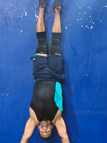 Getting comfortable being upside down. This member is working on his handstand hold, a key skill in our gymnastics training.
