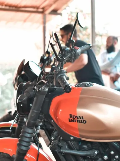 A detail shot focusing on the iconic Royal Enfield logo on the fuel tank. These clean, product-focused shots are essential for any automotive brand's visual library.